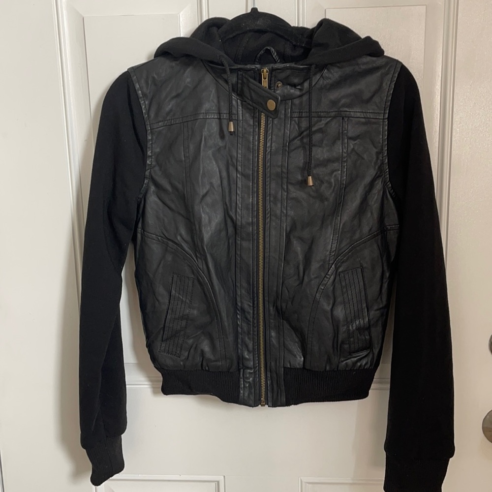 Black half Leather half jacket material. Super cute also keeps you warm!